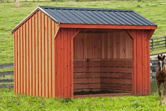 Board and batten horse barn in a pasture