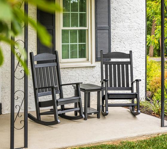 rocking chairs with end table on farmhouse porch